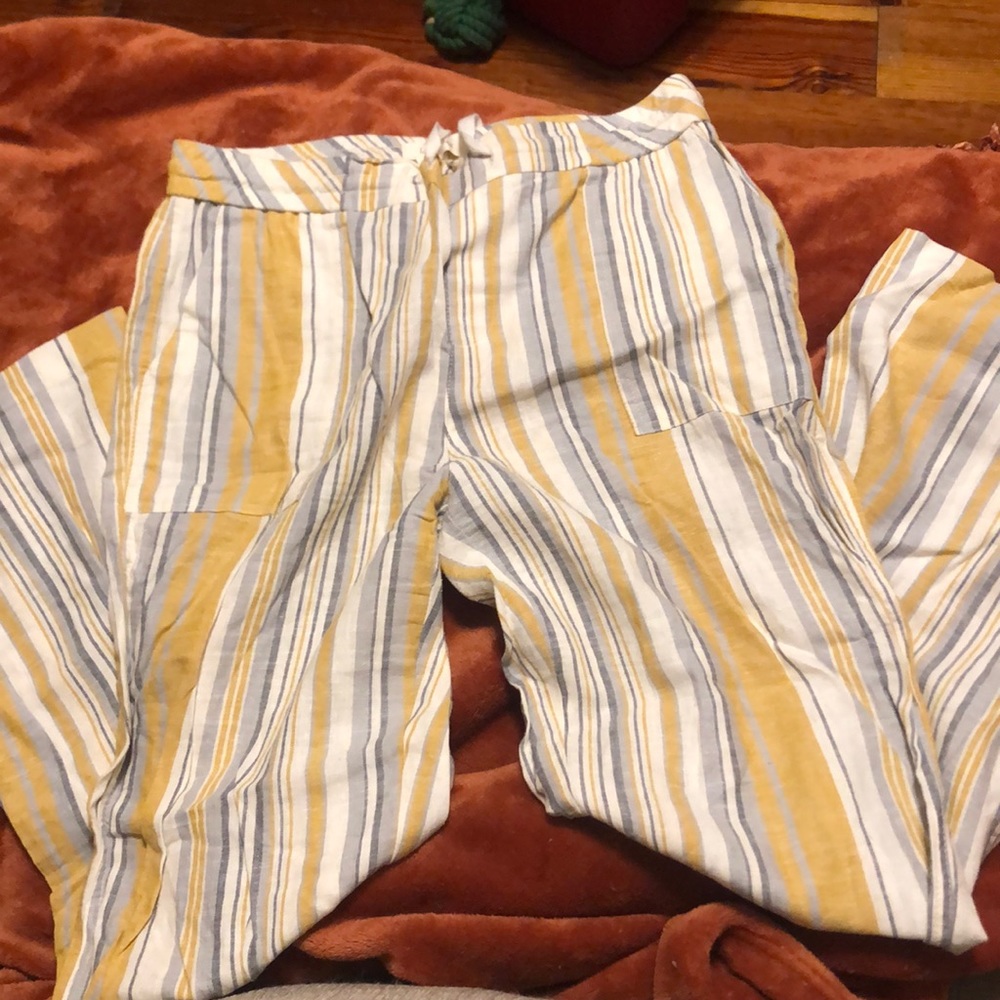 Yellow and blue striped flowy pants.